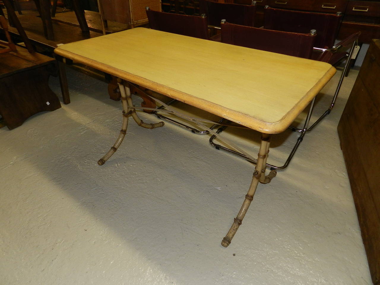 Yellow painted table with oak top and cast iron bamboo style base.