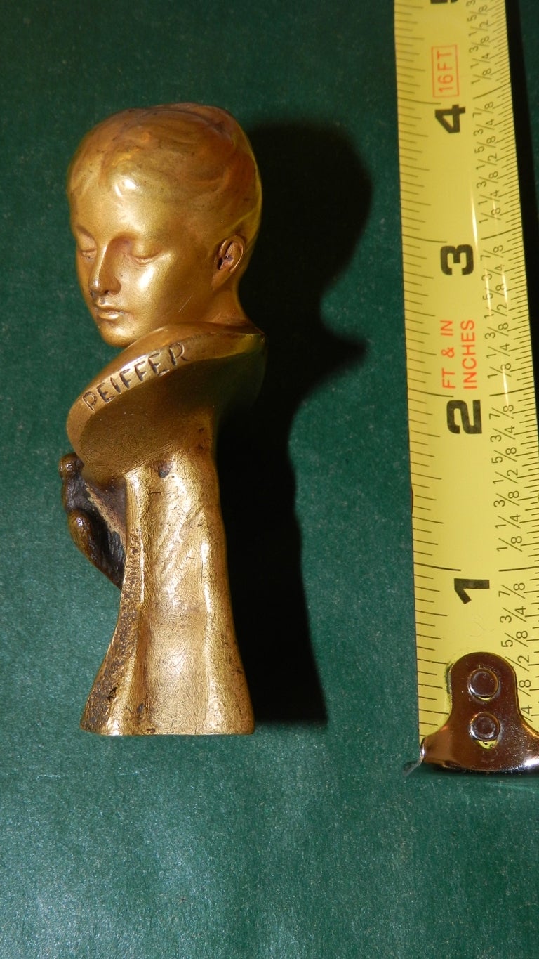 This is a fabulous gilded bronze stamp signed  by the creator; Auguste Joseph Peiffer (1832-1886).  With good weight and depicting a serene woman with doves at breastbone, the piece has the stamp of the Susse Frere Foundry to reverse. The initials
