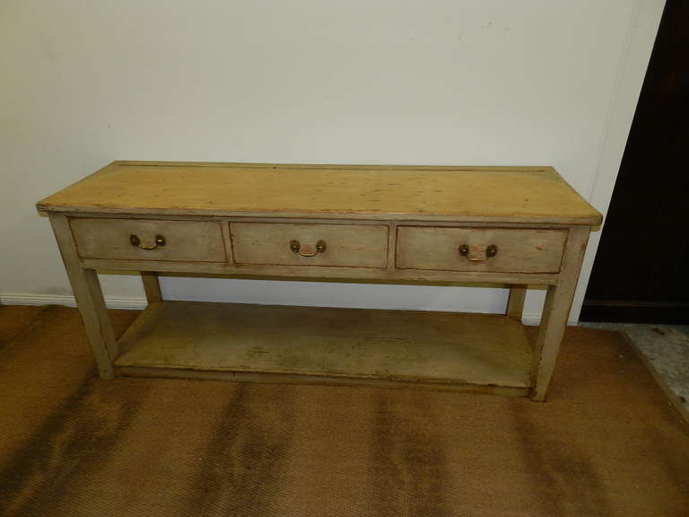 Antique pine server with distressed paint finish,3 drawers and pot board base. Drawers are dovetailed and top has a groove for plate display.