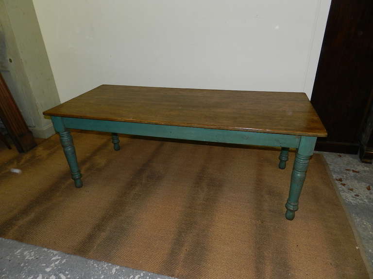 Antique pine farm table with scrubbed pine top ,turned legs and original green paint.