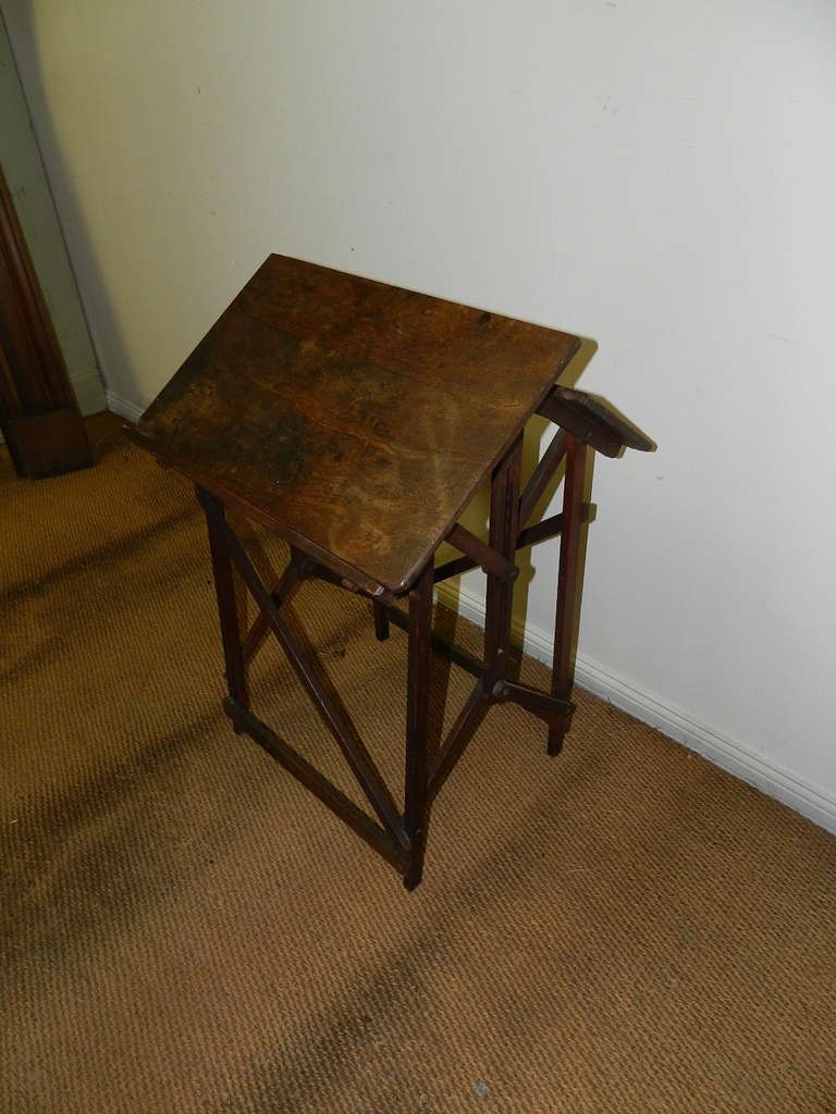 Officer's Mahogany campaign table with unique folding mechanism . This table is stamped Hatherley Patent. It was used both as a battle sketching table and or a desk .Named after  Hatherley Manor this table was designed by Charles Allan Jones  for