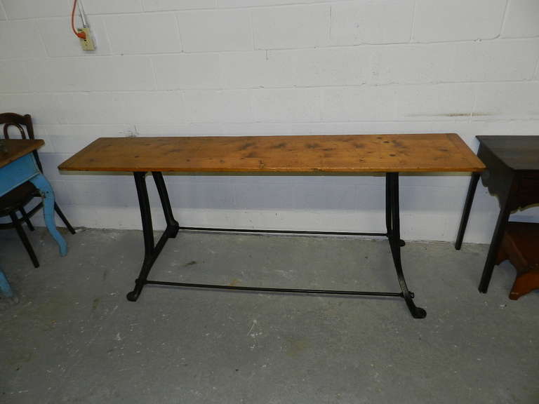 Pine table on Industrial type iron base.