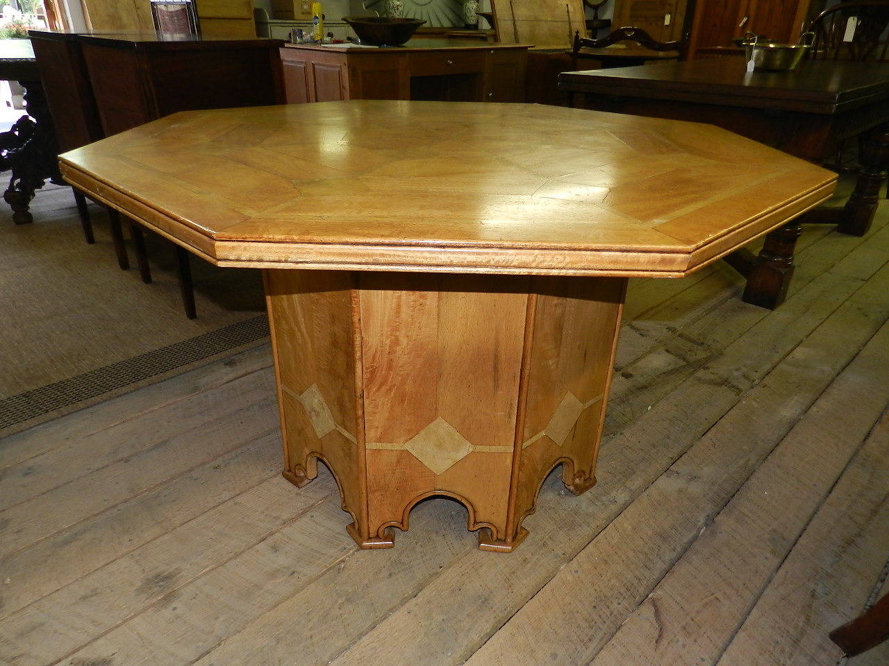 Octagonal mahogany dining or center table with inlaid marble top and pedestal by Barker and Stonehouse, England