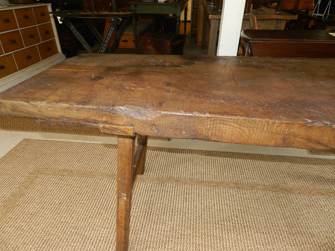 Solid chestnut work table. The thick top exhibits the beautiful patina which can only be created from many years of use.