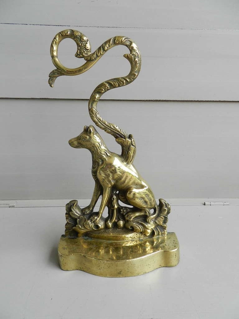 Solid brass doorstop depicting a seated dog