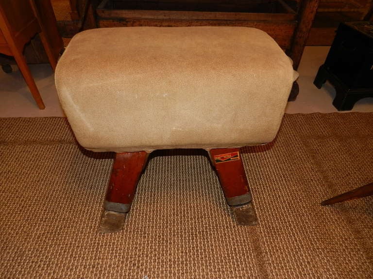 Pommel horse bench. This piece is covered in brushed leather and has pitch pine legs.  It stands 24 inches high so will make a perfect bench.  The manufacturer is Neils Larsen of Leeds, England circa 1960.