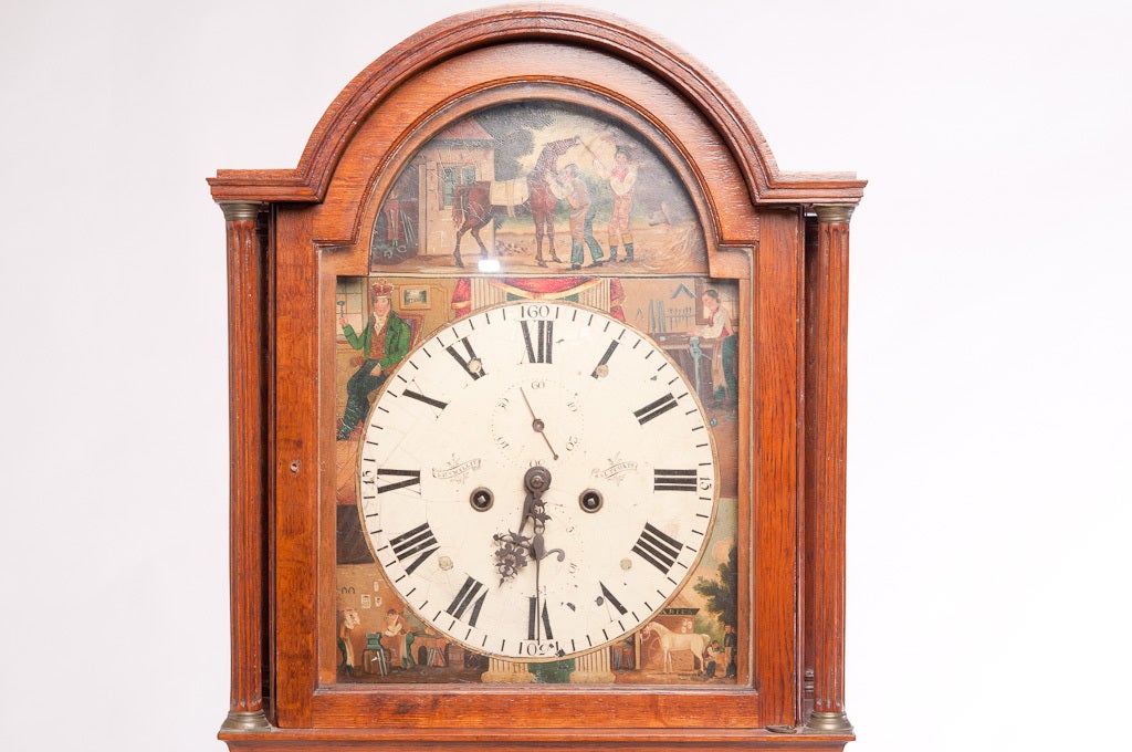 This is a Scottish oak eight day grandfather clock by David Wyllie,Saltcoats,Scotland.
The painted face has hand painted equestrian scenes.