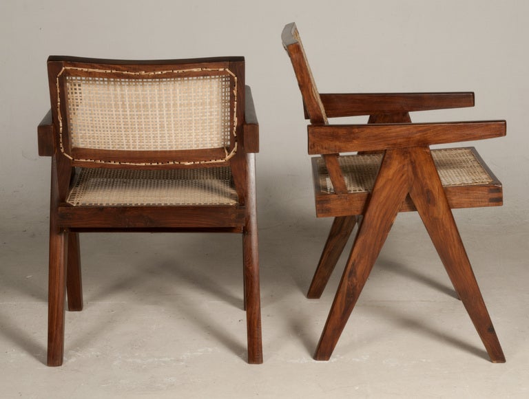 A pair of armchairs in Indian Rosewood (sisso) by Pierre Jeanneret.
Newly re-caned.
the 2 armchairs are slightly different, one a little stronger than the other. 
Armchairs came from Punjab University in Chandigarh, India.

Same model in 