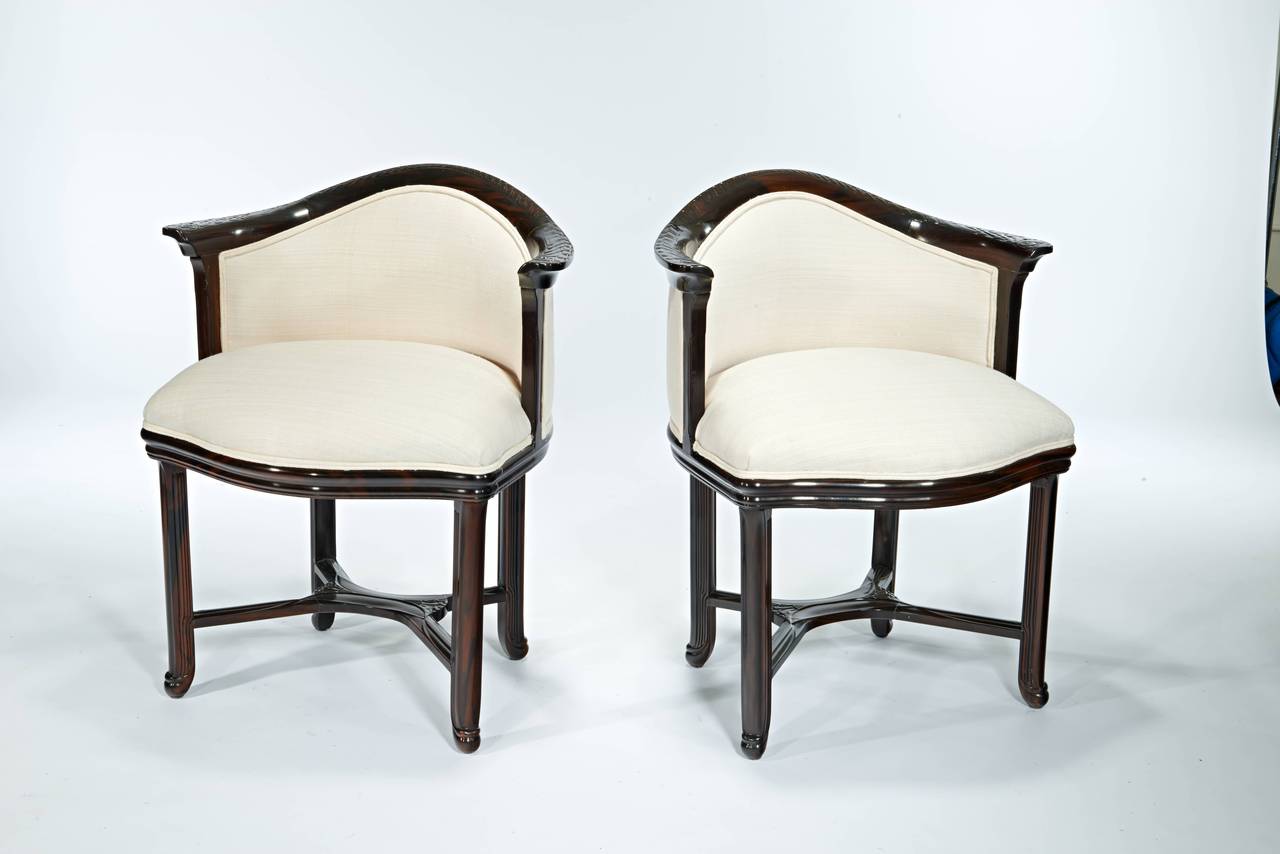 A beautiful pair of documented Majorelle armchairs in a hand polished solid Macassar ebony frame with silk upholstery.