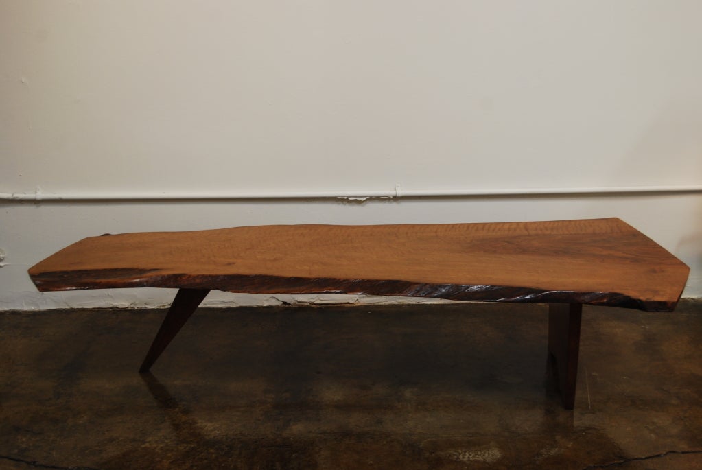 This is a phenomenal example of a slab one coffee table, in a very rare wood.

An east coast architect had purchased a very large order of this Persian walnut sight-unseen. When it arrived, he disliked it and offered it to George for a discounted