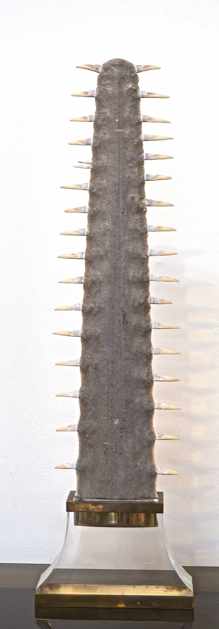 Sawtooth sculpture signed Gabriella Crespi on base.