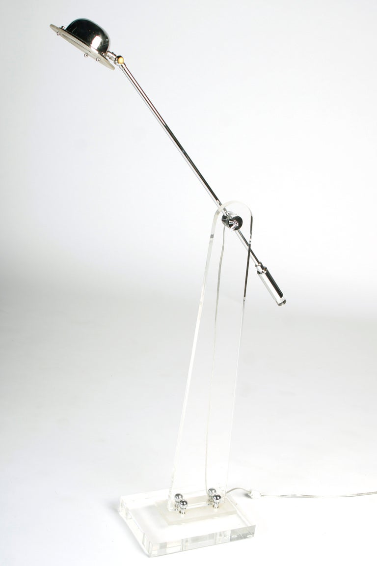 This chrome and lucite floor lamp epitomizes high fashion from the 70's. At home with Paul Evans, Milo Baughman, or Roger Sprunger,  this lamp is the final piece to top off your room.