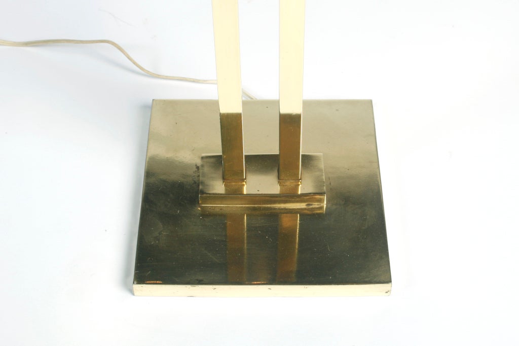 Striking brass floor lamp by Laurel makes impression in any room it's in.  Rectangular shade included.