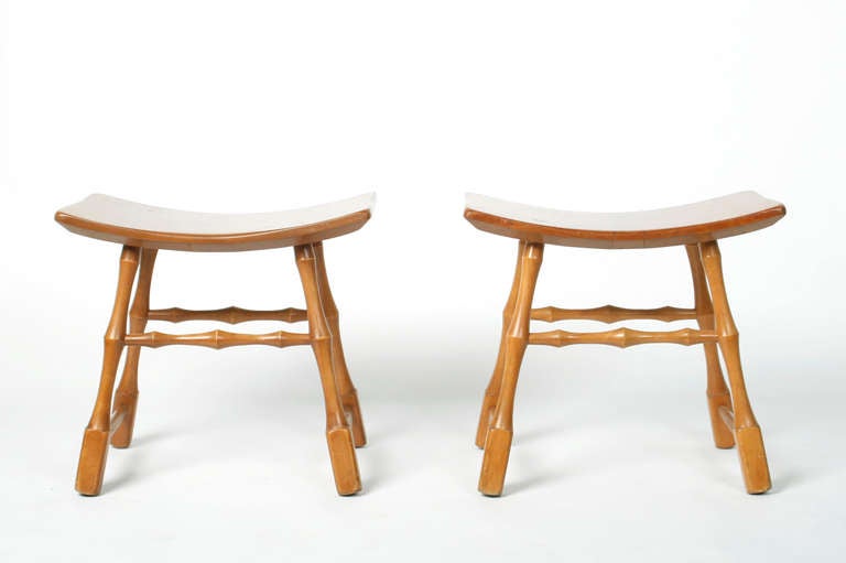 Pair of interesting asian style walnut stools with curved seats and bamboo legs to accent your decor. 