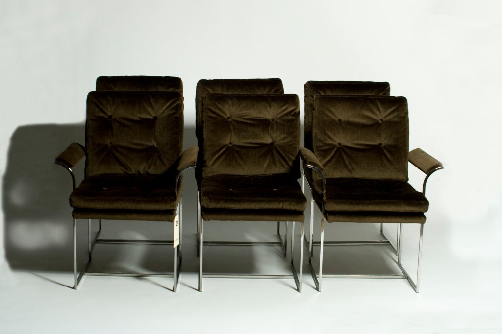 Four dining chairs and two captain's chairs by Milo Baughman for Directional.