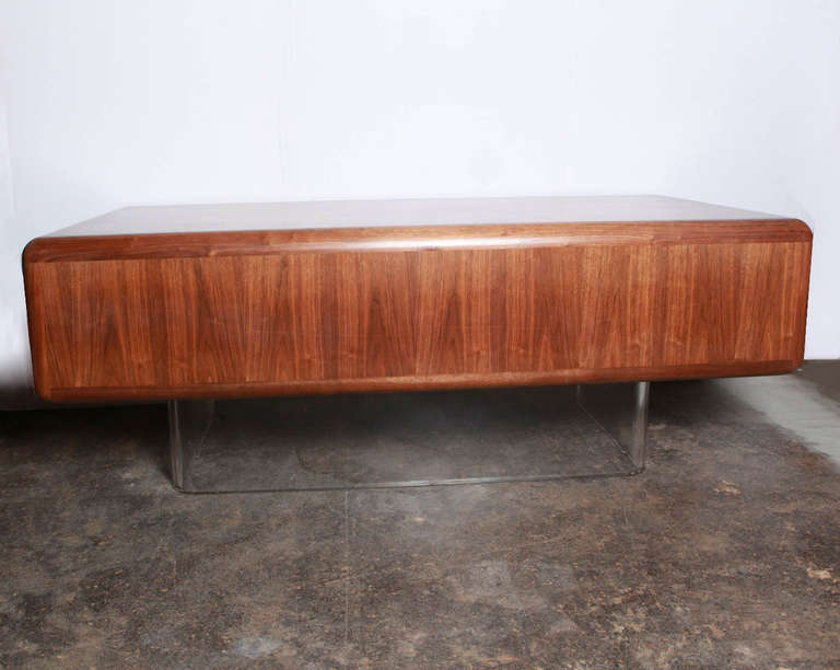 Iconic and stunning walnut and lucite desk restored to original condition.