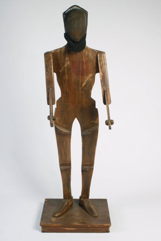 Early 20th century unusual life size hand made European fencing dummy.     Comes complete with mask and foil.  On guard