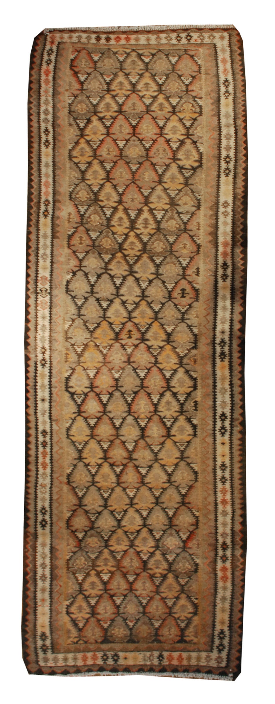 An early 20th century Persian Qazvin Kilim runner with a beautifully woven tree-of-life pattern, surrounded by multiple complementary geometric borders.