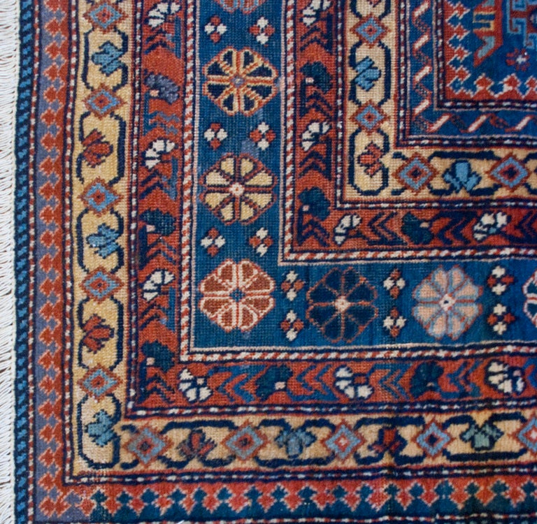 An early 20th century Caucasus region Shirvan rug with geometric field surrounded by multiple contrasting borders.

Measures: 3'8