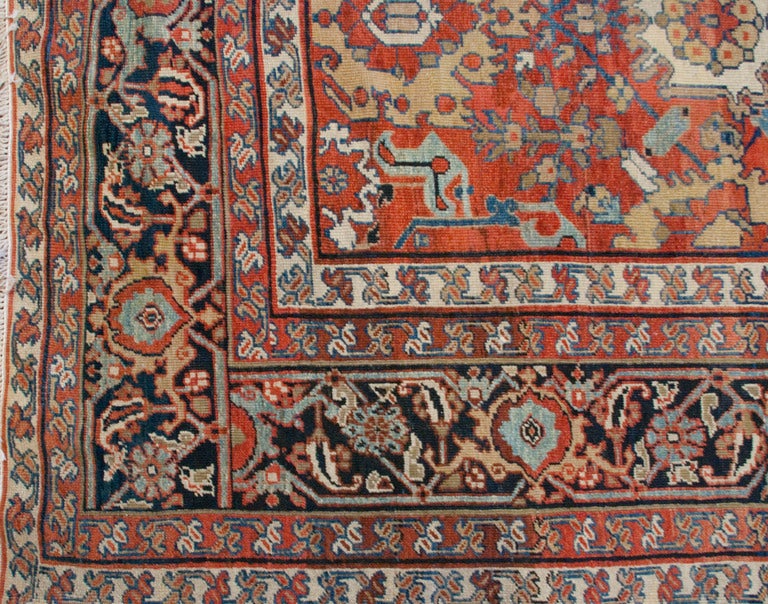 A mid-20th century Persian Sultanabad carpet with wonderful all-over floral lattice pattern on a crimson background, surrounded by multiple floral and vine borders.
Measures: 8.6