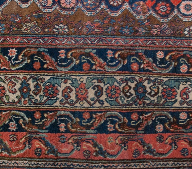 An early 20th century Persian Malayer rug with central medallion amidst a field of flowers surrounded by multiple borders.
 Measures: 7' x 17'.
                

Keywords: Rug, carpet, Serapi, Heriz, Tabriz, Bakhshaish, kilim.