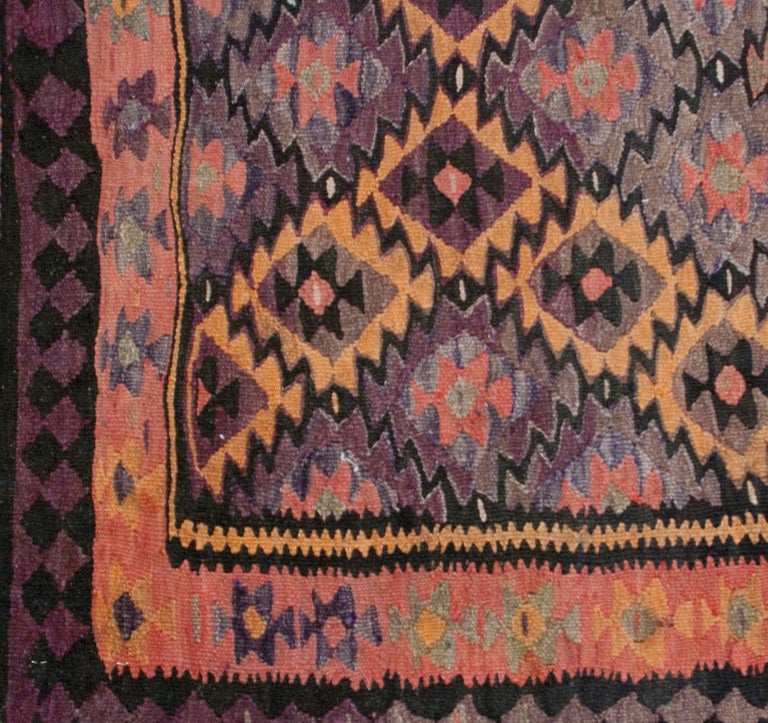 An early 20th century Persian Qazvin kilim rug with all-over geometric 