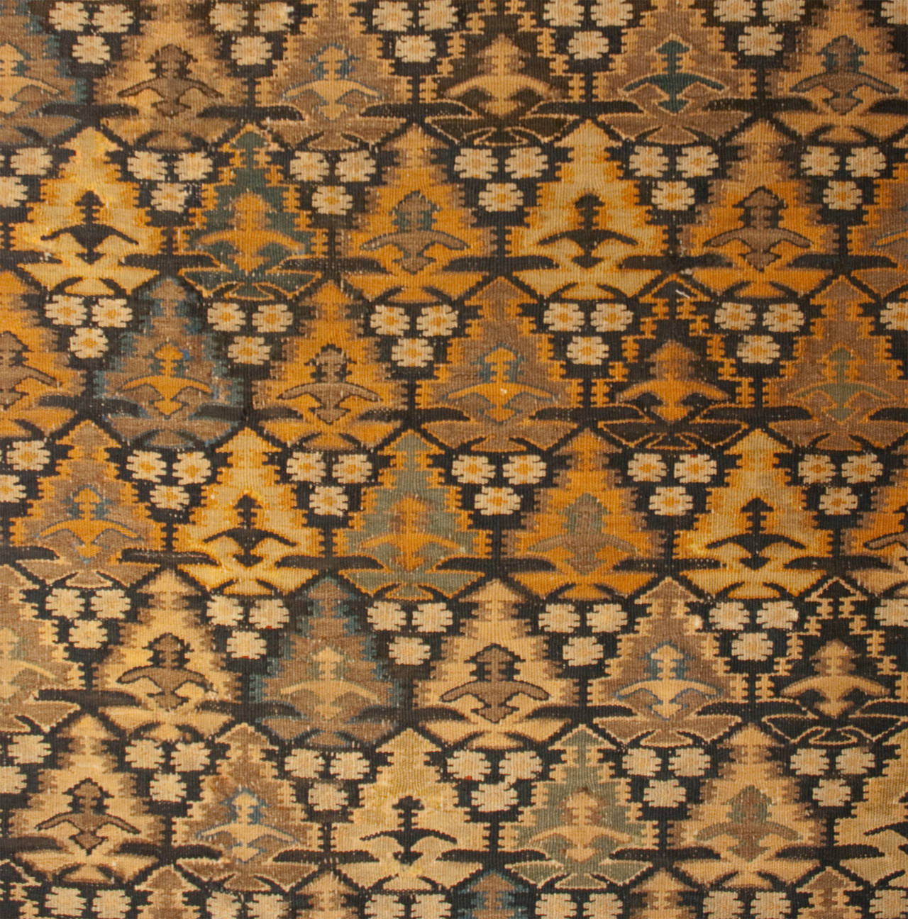 An early 20th century Persian Qazvin Kilim runner with an all-over multicolored tree-of-life pattern surrounded by multiple complementary geometric and floral border.