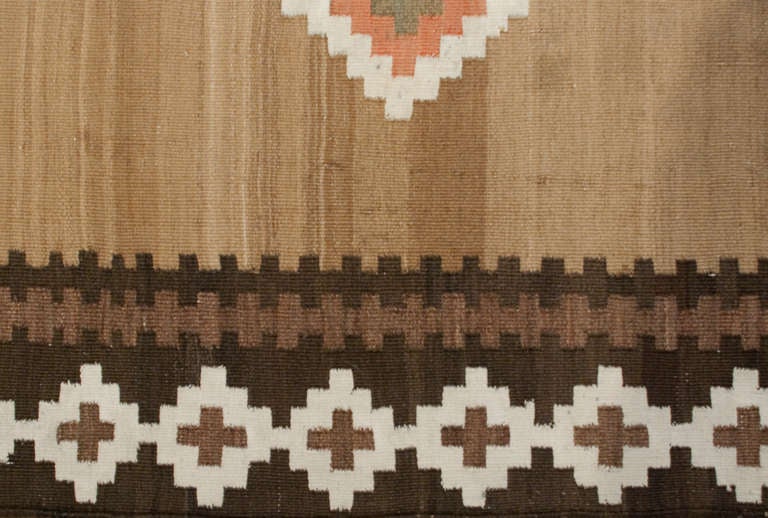 An early 20th century Persian Kelardasht Kilim runner with all-over multicolored diamond pattern on a natural wool background surrounded by a complementary diamond border.
