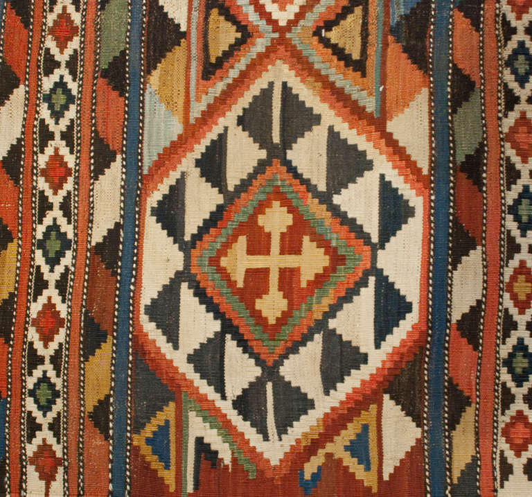 An antique, late 19th century, Persian Shirvan Kilim rug with amazing brilliant multi-colored intricately woven rug with a gorgeous repeated diamond and triangle pattern.