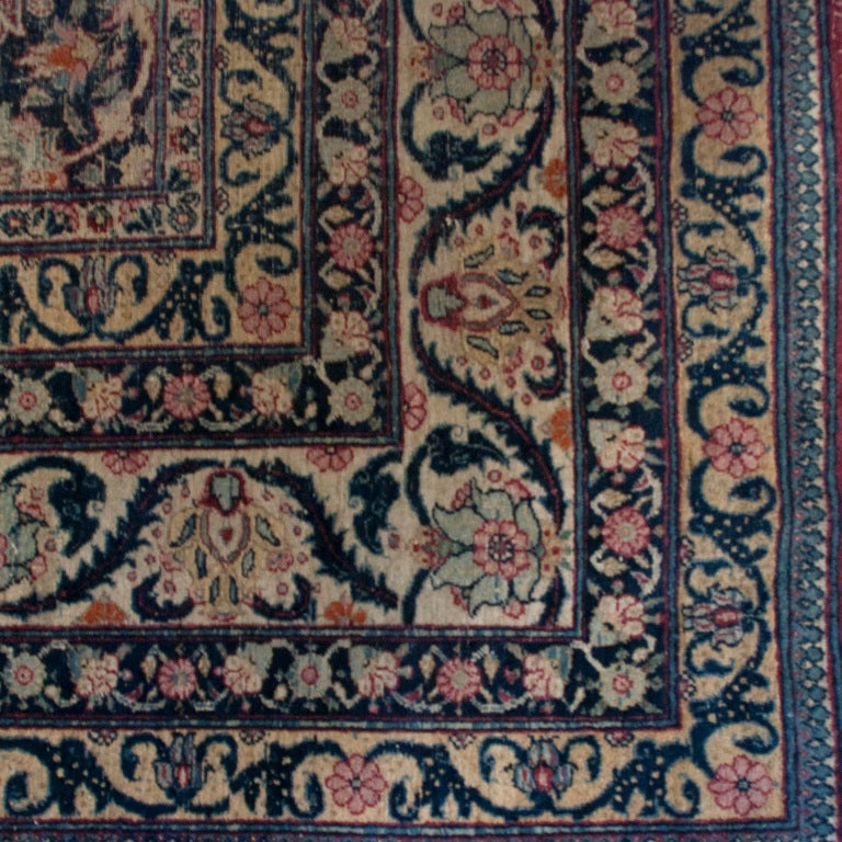 A 19th century Persian Kermanshah carpet with all-over floral and vine pattern on an indigo background surrounded by a complementary border.

Measures: 7.6