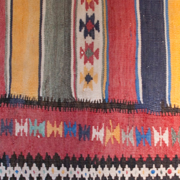 An early 20th century Persian Zarand Kilim carpet runner with alternating stripe and geometric pattern surrounded by a contrasting geometric border.

Measures: 3'3