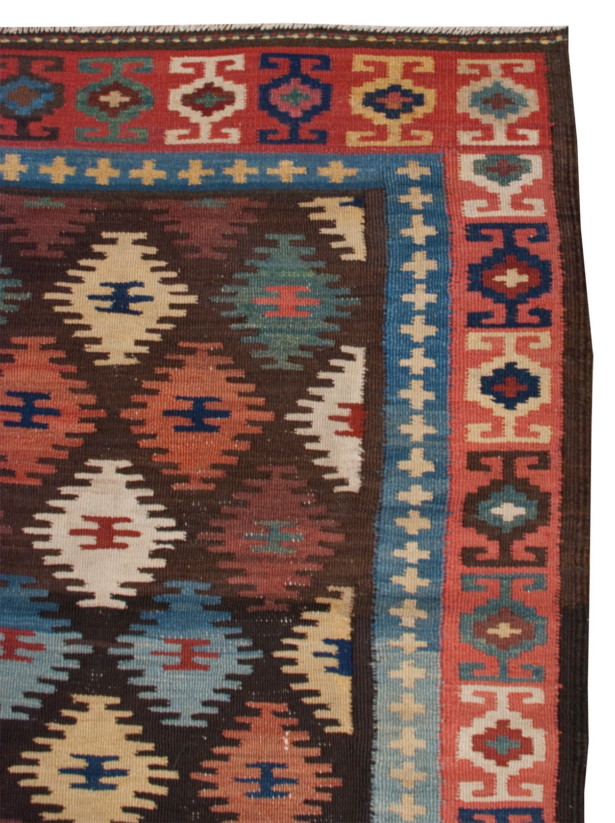 An early 20th century Persin Hersari Kilim runner with a beautiful multicolored diamond field, surrounded by a complementary multicolored geometric border.