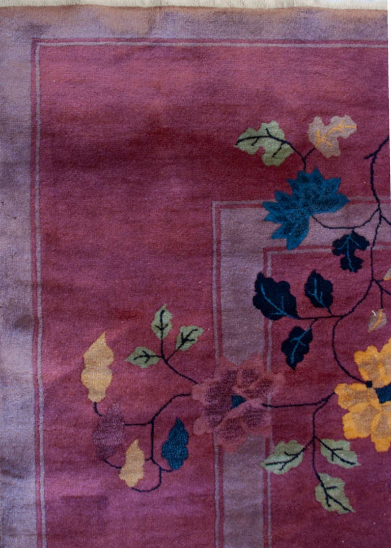 An early 20th century Chinese Art Deco rug with a rich fuchsia background and asymmetrical multicolored floral pattern.

Reza's Rug Gallery #: CH94

Keywords: Rug, carpet, textile, Art Deco, Chinese. Measures: 8'8