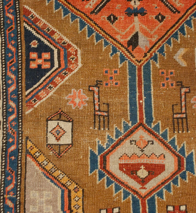 An antique, late 19th century, Persian Serab runner with multiple diamond medallions on a natural wool background surrounded by a beautiful contrasting floral and vine border.
