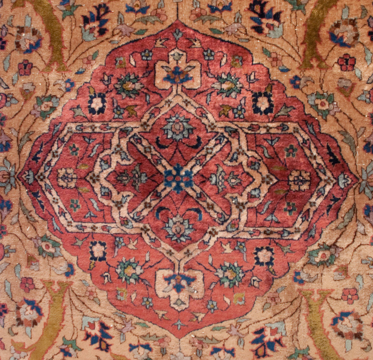 A late 19th century Indian Agra rug with an intensely woven landscape of Cyprus and flowering trees, with an all-over blooming vine lattice pattern uniting the entire composition, with multiple contrasting floral borders.