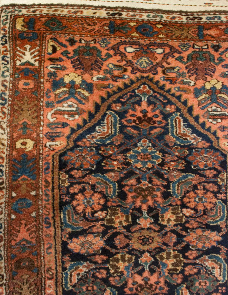 A beautiful early 20th century Persian Malayer Herati runner with a central geometric medallions on a field of flowers, surrounded by a complementary floral border.