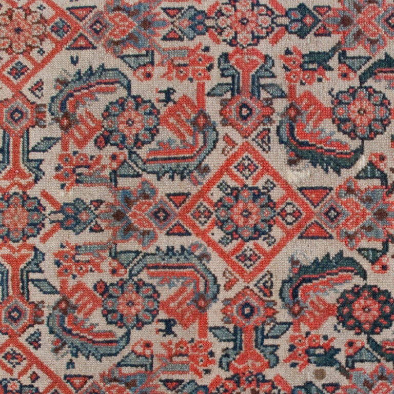A 19th century Persian Semmeh carpet woven in a Herati pattern consisting of floral and leaf motifs surrounded by a contrasting floral border. Measure:4'5