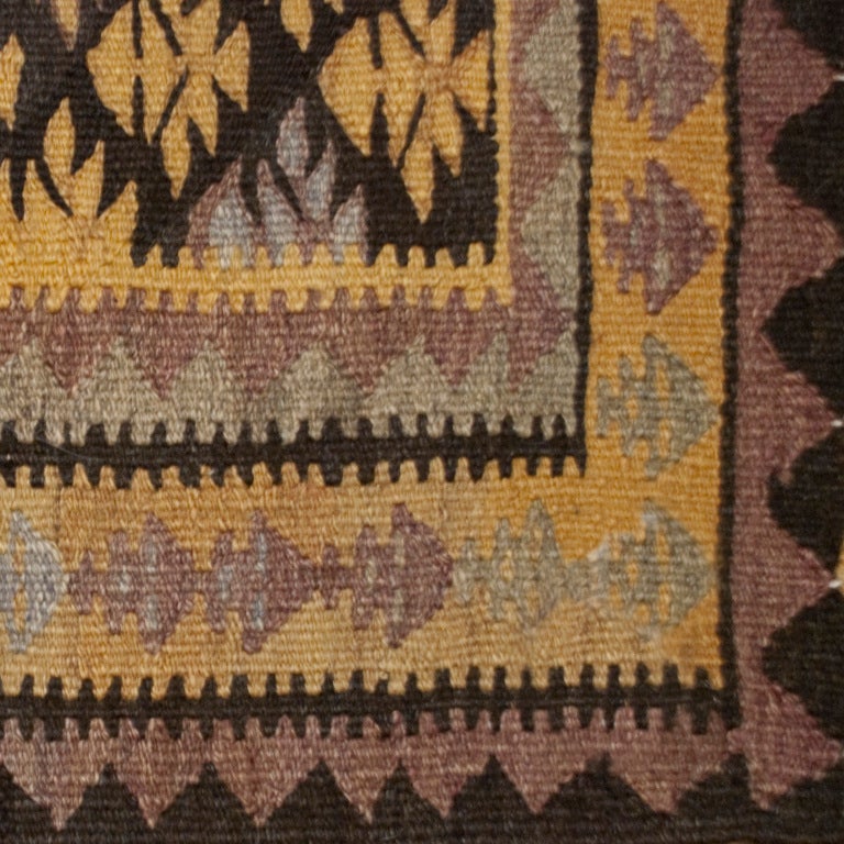 An early 20th century Persian Qazvin Kilim carpet with an all over stylized tree pattern in muted earth-tones.<br />
<br />
Reza's Rug Gallery #:  R1835<br />
<br />
<br />
Keywords:  Rug, carpet, textile, tribal, Persian, Azeri, Heriz, tribal,