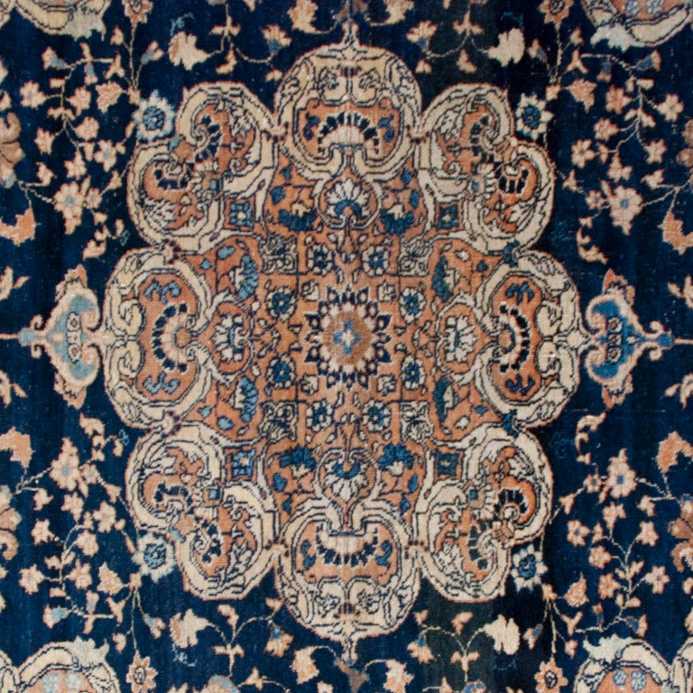 A 19th century Persian Tabriz carpet with very traditional floral and vine motifs surrounding a large central medallion surrounded by a wonderful multi layered border, 6'5" x 4'6".



Reza's Rug Gallery #: R708.





Keywords: