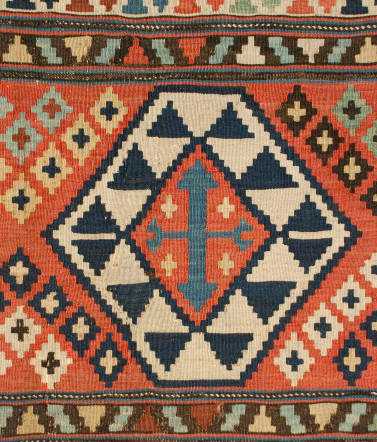 An exceptional 19th century Persian Shriven Kilim rug with a bold pattern of alternating multicolored stripes.