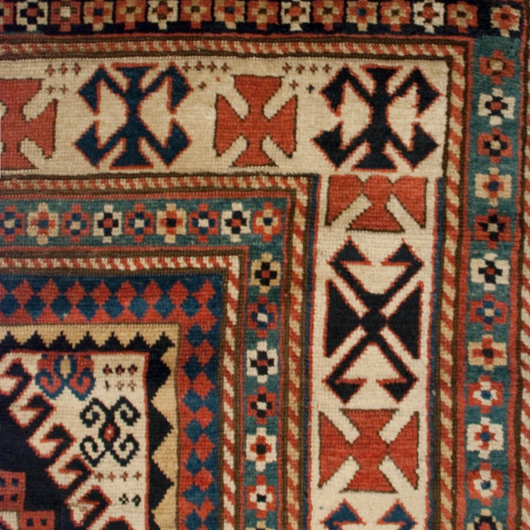 A 19th century Karachoff Kazak carpet with three central diamond medallions surrounded by tribal motifs, with a multiple layered border.



Measures: 5' x 7'5".





Keywords: Rug, carpet, textile, Persian, Azeri, Heriz, tribal,