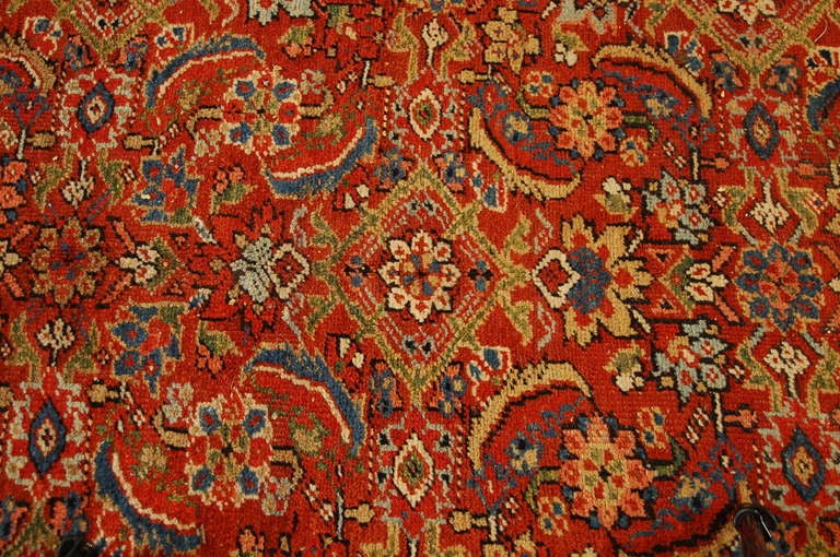 An early 20th century Persian Heriz rug with all-over floral and leaf pattern on a brilliant crimson background surrounded by multiple contrasting floral borders.

       

Keywords: Rug, carpet, Persian, Central Asian, Tabriz, Heriz, Serapi,