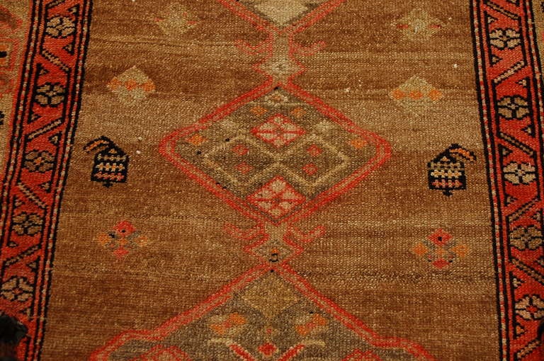 A late 19th century Persian Malayer rug with multiple geometric medallions on a natural wool background surrounded by multiple complementary geometric patterned borders.

Reza's Rug Gallery #: R2140.

Keywords: Rug, carpet, Persian, Central