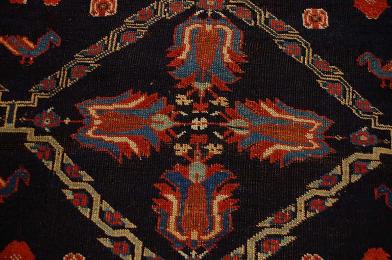 A 19th century Persian Afshar rug with asymmetrical central floral medallion on an indigo background, surrounded by multiple intricate floral borders.

Reza's Rug Gallery #:  R2139

Keywords:  Rug, carpet, textile, Serapi, Tabriz, Heriz,