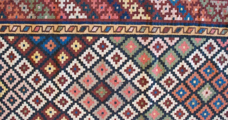 An early 20th century Persian Shahsavan Kilim runner with wonderful all-over multicolored diamond pattern with a complementary multicolored geometric border.