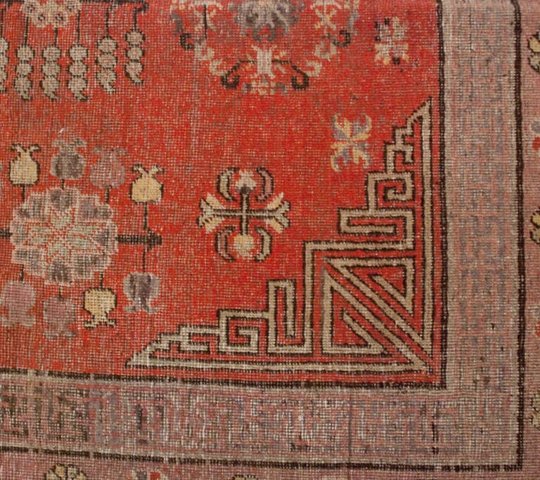 A late 19th century Central Asian Khotan rug with all-over floral pattern on a crimson background, surrounded by multiple contrasting borders.



Keywords: Rug, carpet, textile, quilt, wall hanging, Samarkand, Khotan, Persian.