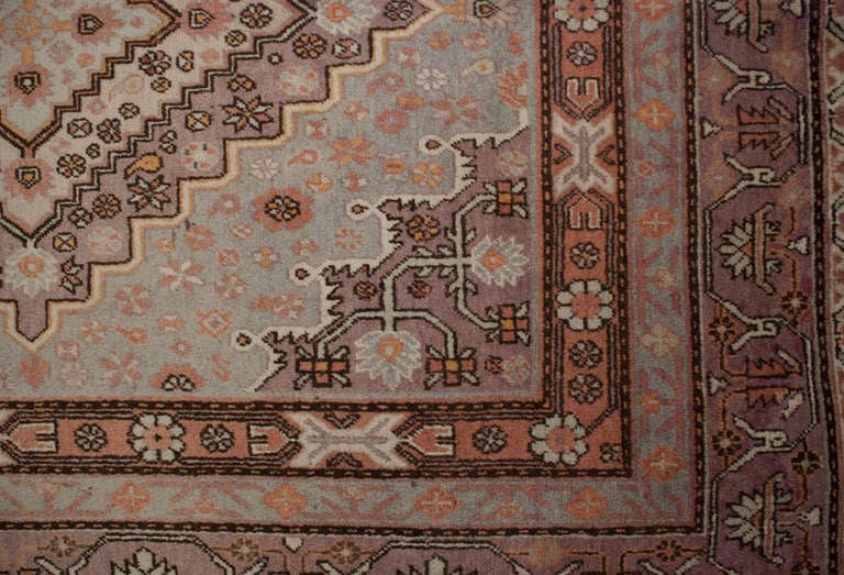 An early 20th century Central Asian Khotan rug with two diamond medallions surrounded by multiple contrasting floral borders.

 

Keywords: Rug, carpet, textile, quilt, wall hanging, Samarkand, Khotan, Persian.