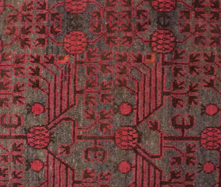 An early 20th century Central Asian Khotan rug depicting an all-over pomegranate pattern surrounded by multiple floral borders.

Reza's Rug Gallery #: ABD114.

Keywords: Rug, carpet, Khotan, Samarkand, Yarghand, Heriz, Tabriz, Serapi, Kirman.