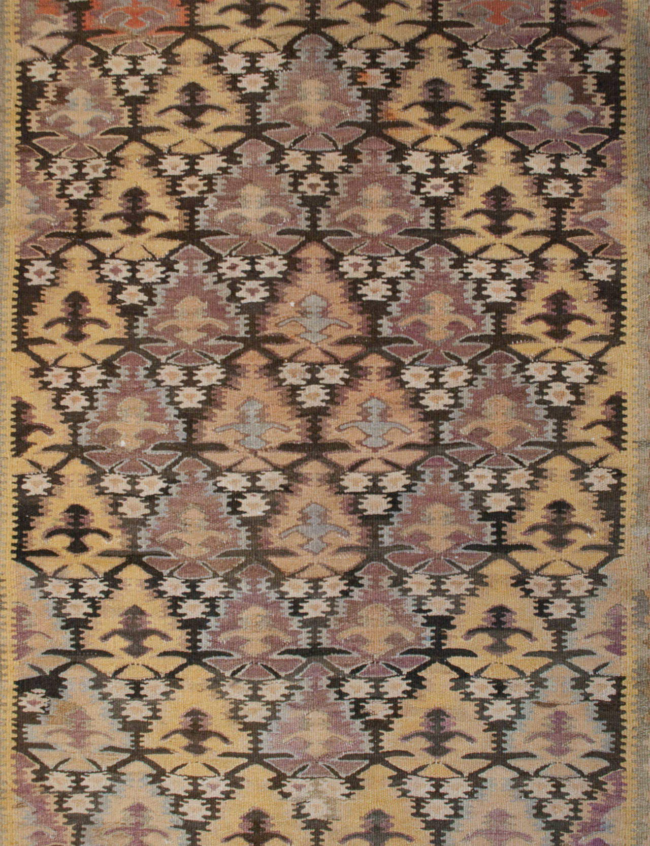 An early 20th century Persian Qazvin Kilim runner with beautiful all-over stylized tree-of-life pattern surrounded by multiple floral and geometric borders.