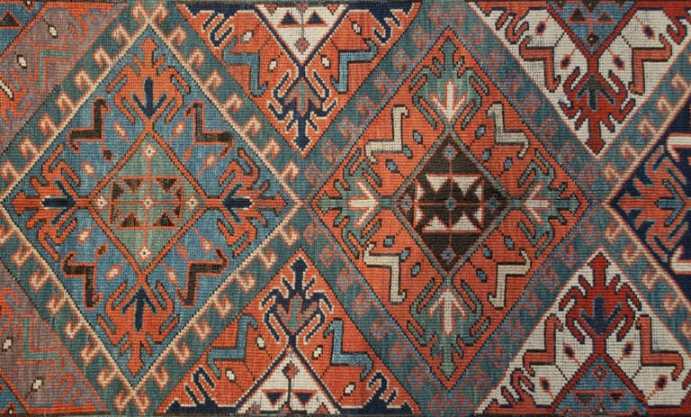 A 19th century Persian Shirvan runner with six multicolored diamond medallions surrounded by multiple contrasting floral borders.

 